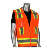 A mannequin showcases the PIP Two-Tone Breakaway Surveyors Vest from PIP - Protective Industrial Products, featuring bright orange fabric with yellow and gray reflective tape, layered over a black shirt. This Hi-Vis vest includes multiple front pockets for added convenience and enhanced safety.