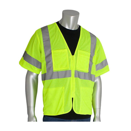 A silver mannequin displays a hi-visibility outfit: the PIP ANSI Type R Class 3 Value Zipper Mesh Vest 303-MVG4P in bright yellow, designed by PIP - Protective Industrial Products. This polyester mesh vest features reflective gray stripes over a black shirt, with two front pockets, silver reflective tape, and a convenient zipper closure.