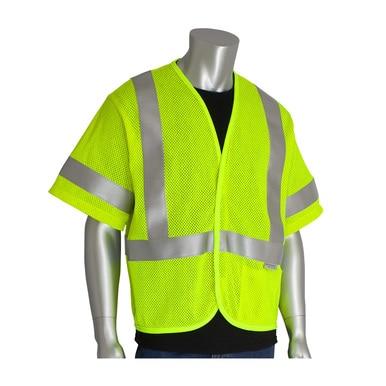 A mannequin showcases high-visibility attire, featuring a neon yellow PIP ANSI Type R Class 3 AR/FR Mesh Vest 305-3100 with silver reflective stripes over a black shirt. This mesh fabric vest from PIP - Protective Industrial Products is designed to meet ANSI Type R Class 3 standards and includes short sleeves for enhanced comfort.