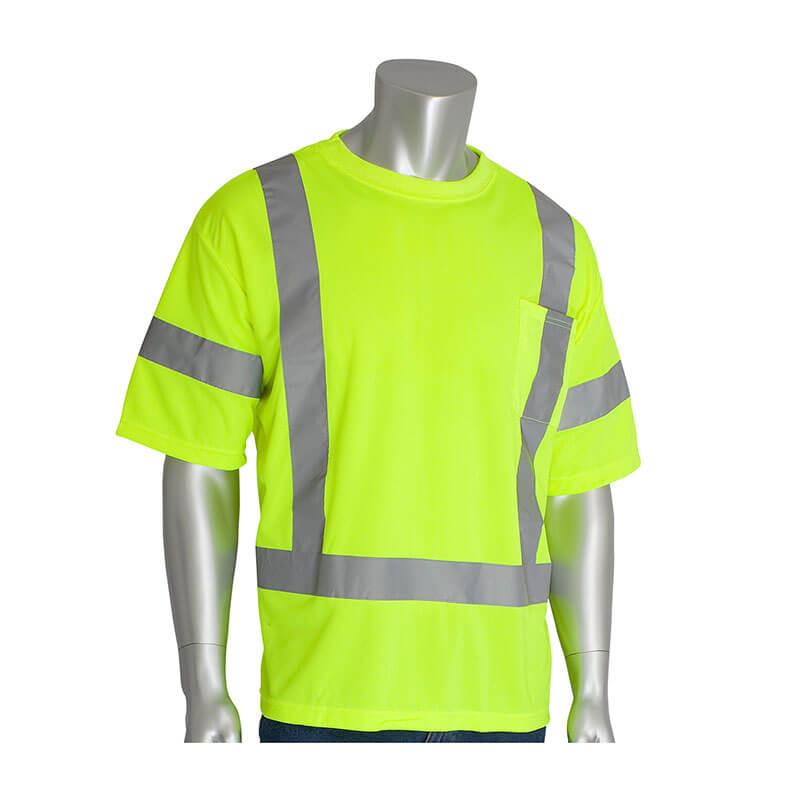 A silver mannequin displays the PIP - Protective Industrial Products ANSI Type R Class 3 Short Sleeve T-Shirt in a vibrant orange color. This hi-visibility safety shirt is designed with gray reflective stripes, crafted from lightweight performance wicking material. It includes a pocket on the left chest and short sleeves, set against a plain white background.