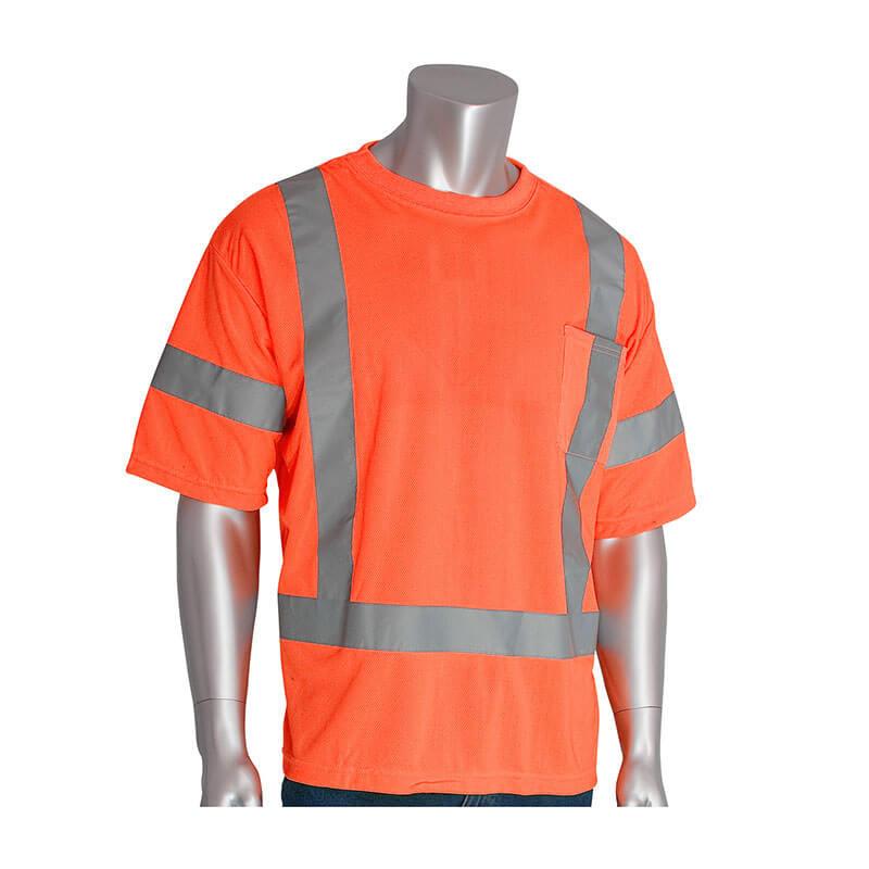 A mannequin is modeling a PIP ANSI Type R Class 3 Short Sleeve T-Shirt in orange, designed by Protective Industrial Products, which features lightweight performance wicking material and reflective silver stripes on the chest, shoulders, and sleeves for high visibility safety.