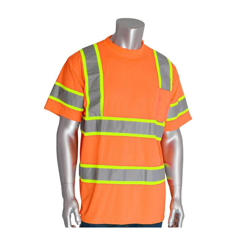 A mannequin is showcasing the PIP ANSI Type R Class 3 Two-Tone T-Shirt 313-CNTSP by Protective Industrial Products. This bright orange safety shirt, made from lightweight performance wicking material, features reflective yellow and gray stripes and a chest pocket, making it ideal for construction workers seeking high visibility in a comfortable short-sleeved design.