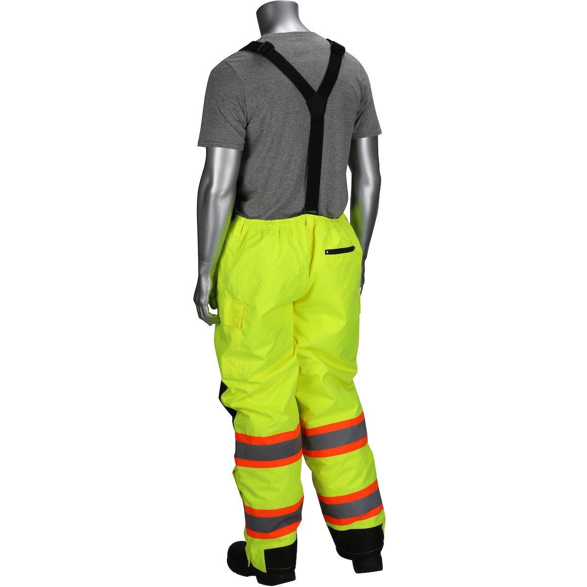 A mannequin displays a gray t-shirt alongside the PIP Ripstop Insulated Two Tone Bib Overalls 318-1780, offered by PIP - Protective Industrial Products. The high-visibility yellow overalls are equipped with suspenders and adorned with reflective orange and black stripes near the hem. Photographed from behind, this outfit delivers both safety and style in one cohesive look.