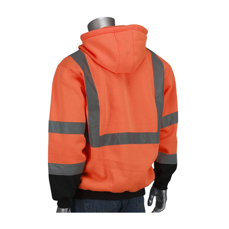 A mannequin dressed in a PIP Full Zip Hooded Sweatshirt w/Black Bottom 323-1370B from Protective Industrial Products, featuring a Hi-Vis Yellow color with reflective gray stripes that meet ANSI Type R Class 3 safety standards. The hoodie includes a front pocket and the hood is pulled up. Paired with blue jeans, it creates the ideal ensemble for high-visibility safety wear.