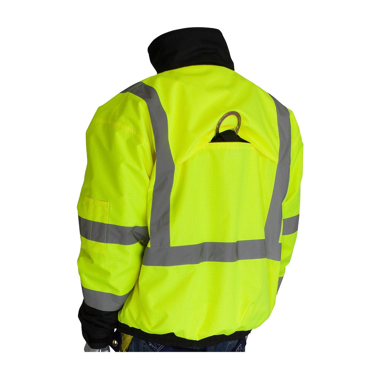 A person is wearing the PIP Rip Stop Premium Plus Bomber Jacket in a bright yellow color with reflective stripes on the back and arms. This jacket, manufactured by Protective Industrial Products (PIP), includes a black collar, a D-ring hook on the upper back, and features a waterproof outer shell. The person is facing away from the camera.