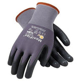 A pair of MaxiFlex Endurance Micro-Foam Grip Gloves from PIP, showcasing a grey and black design with abrasion resistance. These gloves feature seamless knit construction, grip dots on the palms and fingers, an orange cuff, and printed text on the back of the hand.