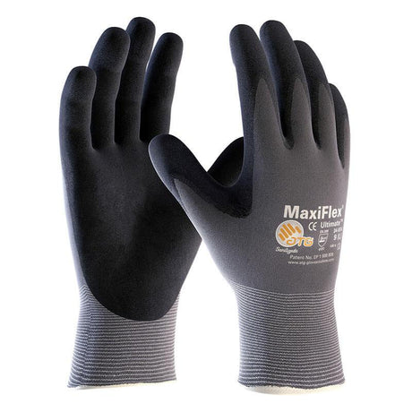 A pair of ATG G-Tek MaxiFlex Ultimate Nitrile-Coated gloves, by PIP - Protective Industrial Products, features a snug fit and a textured palm coating for enhanced grip. These gloves are labeled with various certification symbols and provide excellent finger sensitivity, making them ideal for industrial or general use.