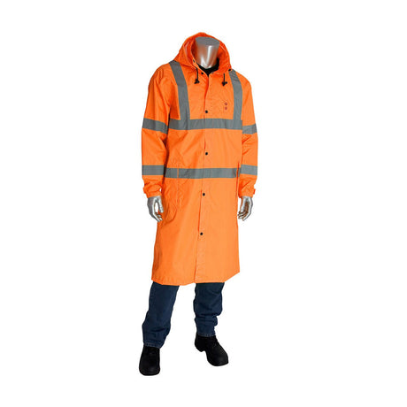 A mannequin showcasing the PIP Hooded Long Reflective Raincoat 353-1048 in hi-vis orange with reflective silver stripes, paired with dark pants and black shoes, stands against a pristine white background.