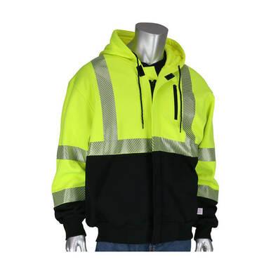 A mannequin showcases the PIP FR Zip Hooded Black Bottom Sweatshirt 385-1370FR-LY, a high-visibility yellow and black safety jacket with reflective stripes, hood, and zippered pockets from Protective Industrial Products. This AR/FR protection gear is expertly paired with blue jeans for a practical yet stylish ensemble.