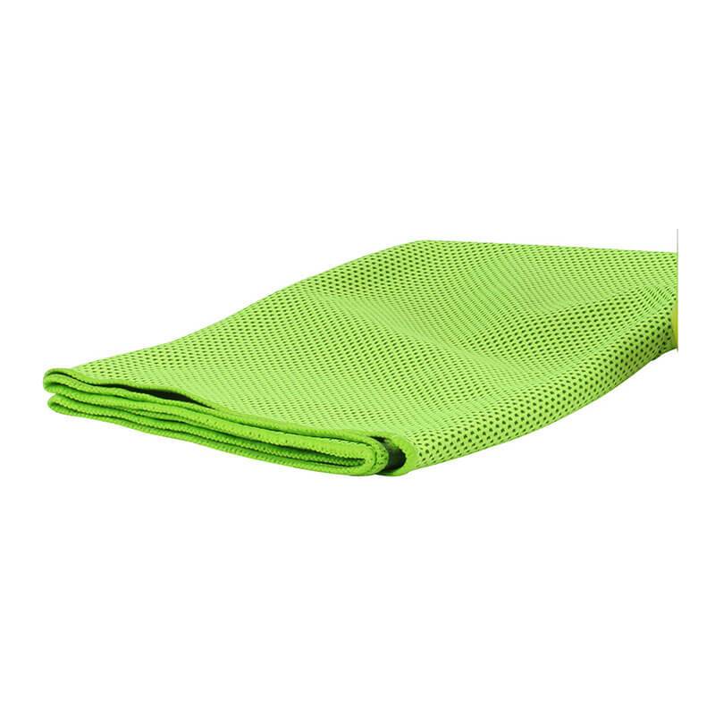 A neatly folded PIP EZ-Cool Max Cooling Towel, featuring a vibrant green color and a textured, perforated microfiber surface, sits against a plain white background and offers the convenience of being reusable and machine washable.