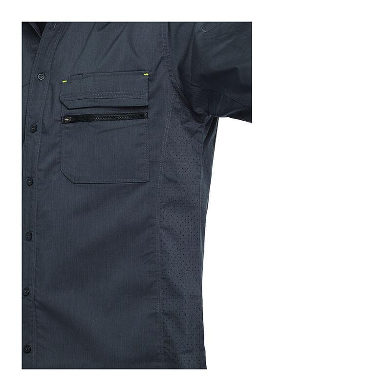 A close-up view showcases the PIP Bisley Ripstop Work Shirt w/X-Airflow 400M6490, a dark-colored design by PIP - Protective Industrial Products. This shirt features two chest pockets: one with a zipper and the other with a flap. It is crafted with short sleeves and incorporates X-Airflow Ventilation for enhanced comfort, displayed against a plain white background highlighting the right side of the shirt.