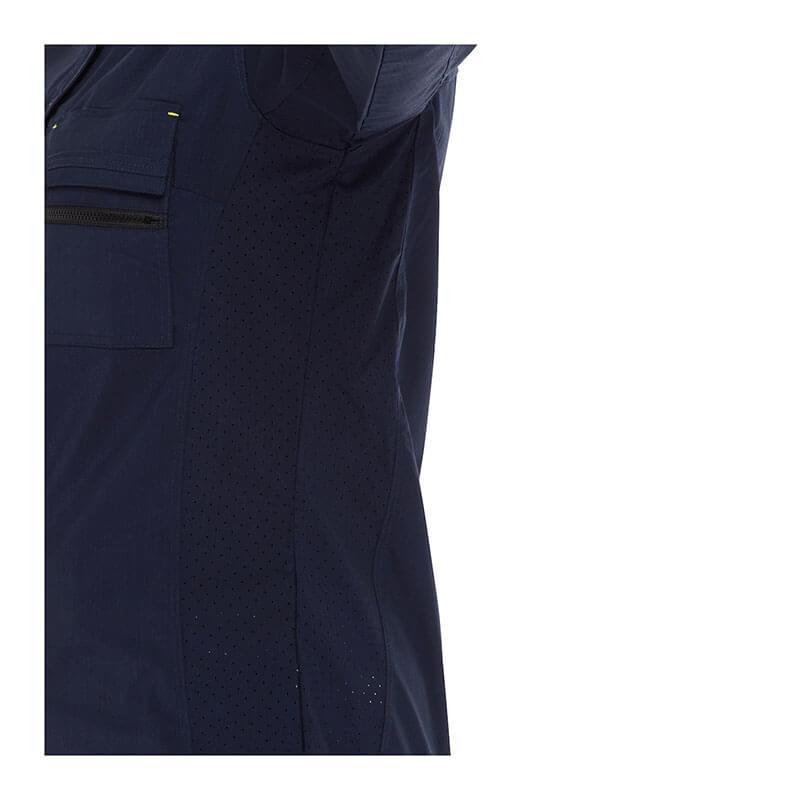 Close-up of the PIP Bisley Women's Ripstop Work Shirt w/X-Airflow 400W6490 in navy blue, highlighting a section with X-Airflow Ventilation near the seam. The fabric appears smooth and slightly textured, featuring a small pocket with a thin zipper.