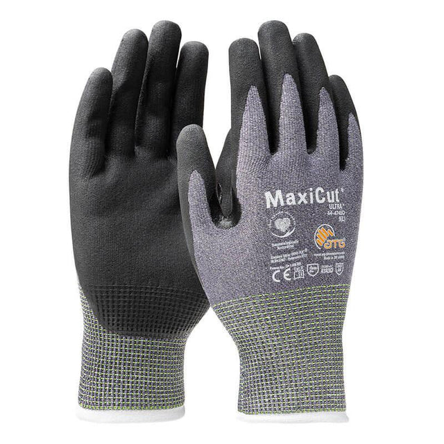 A pair of PIP MaxiCut Ultra Nitrile MicroFoam A4 Gloves 44-4745D in black and grey, designed for cut protection. These gloves from PIP - Protective Industrial Products are touchscreen-compatible, display safety certification symbols, and feature a textured grip pattern on the palms and fingers.