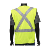 A mannequin displays the PIP Viz-Up 3 Pocket Expandable Mesh Breakaway Vest 4720, an ANSI Type R Class 2 hi-vis yellow safety vest featuring reflective tape in an "X" pattern on the back. This vibrant vest is styled over a gray shirt and paired with blue jeans.