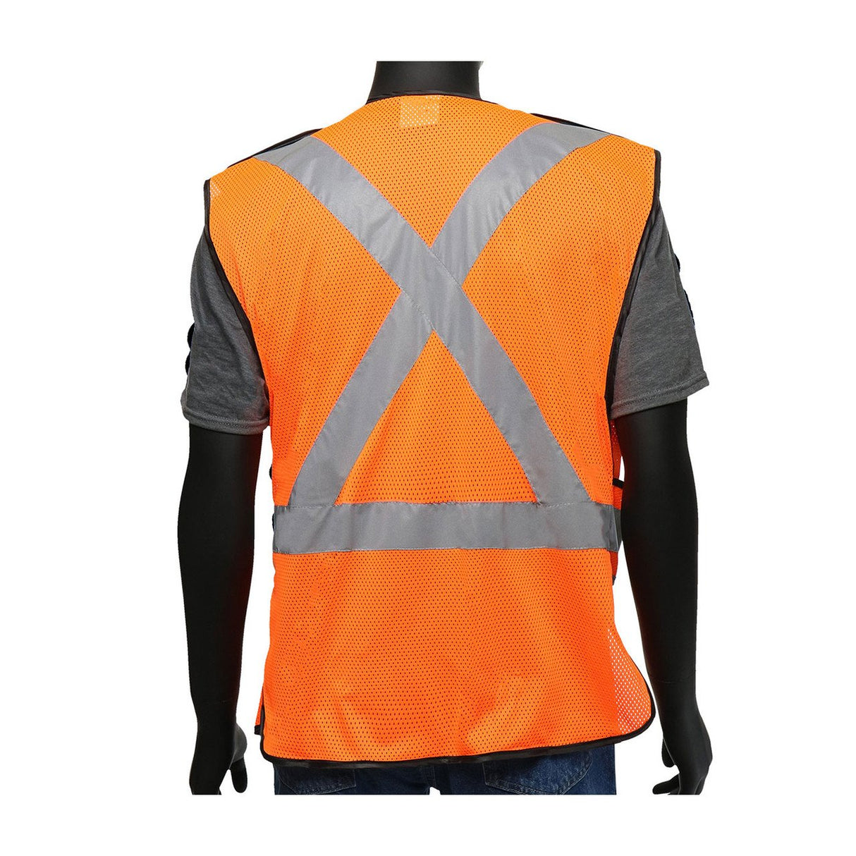 A person wearing a PIP Viz-Up 3 Pocket Expandable Mesh Breakaway Vest 4720 from Protective Industrial Products stands facing away. The orange safety vest, featuring reflective tape in a cross pattern and meeting ANSI Type R Class 2 standards, is worn over a gray shirt and blue jeans against a plain white background.