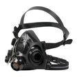 The PIP North 7700 Series Silicone Half Mask by PIP is a black industrial respirator made of medical-grade silicone with dual adjustable straps, multiple filter attachment points, a clear faceplate, and a circular front filter for protection against airborne contaminants.
