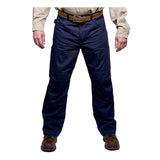 A person dressed in GRIT FR Workwear's dark blue GRIT FR Cargo Pants, a beige long-sleeve shirt, and brown shoes. The pants provide CAT2 protection with multiple pockets, and the person's hands are positioned at their sides out of sight.