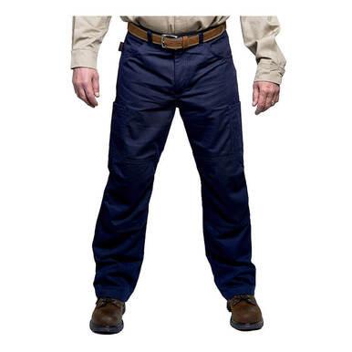 Wearing a beige shirt fastened with a brown belt, the individual stands straight with hands by their sides, donning the GRIT FR Cargo Pants in blue made of FR twill. Brown shoes complete this protective and stylish look from GRIT FR Workwear. The image highlights their lower body, showcasing CAT2 protection apparel designed for safety and style.