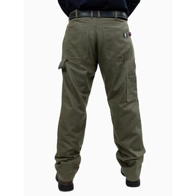 A rear view of a person wearing the GRIT FR Carpenter Pants Green Duck, crafted by GRIT FR Workwear for durability using resilient 8.5 oz. fabric and featuring multiple pockets. The pants are accessorized with a black belt and sturdy black shoes, set against a plain white background to highlight their practical workwear style.