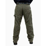 A rear view of a person wearing the GRIT FR Carpenter Pants Green Duck, crafted by GRIT FR Workwear for durability using resilient 8.5 oz. fabric and featuring multiple pockets. The pants are accessorized with a black belt and sturdy black shoes, set against a plain white background to highlight their practical workwear style.