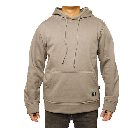 The person is wearing the GRIT FR Pullover Hoodie by GRIT FR Workwear, featuring flame-resistant material, a front pocket, and drawstrings. It's paired with dark jeans. A small logo tag decorates the hoodie near the pocket. They stand against a stark white background, showcasing practical apparel for electrical work.