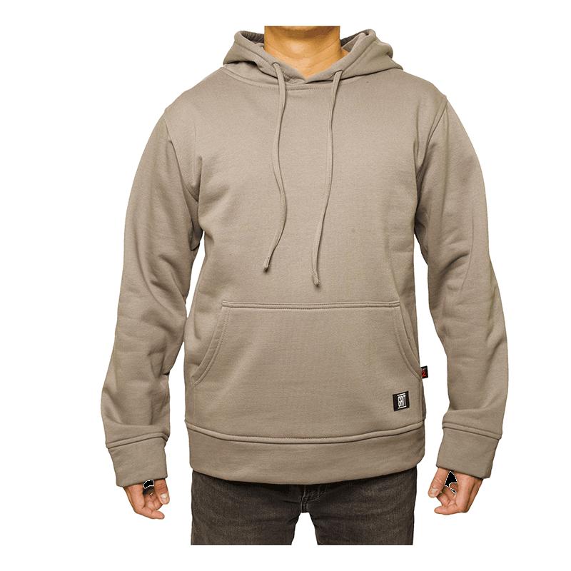 A person wearing the GRIT FR Pullover Hoodie by GRIT FR Workwear, which is a plain beige flame-resistant hoodie featuring a front pocket and drawstrings, paired with dark jeans, stands against a white background.