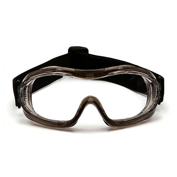 Featured against a white background is a pair of Pyramex Low-Profile Chemical Splash Goggles G7_4T, showcasing their clear lenses and black adjustable strap. Crafted by Pyramex Safety, these goggles feature a sleek design with an anti-glare frame, making them perfect for ensuring safety and eye protection in industrial chemical environments.