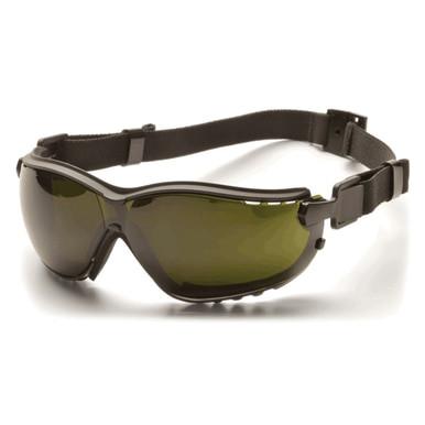 The Pyramex V2G Welding Safety Glasses GB18_0SFT, available from Pyramex Safety, are tinted in dark green and come with a black adjustable strap. These glasses boast a sleek design with IR filter lenses, offering comprehensive eye coverage, UV protection, and enhanced safety.