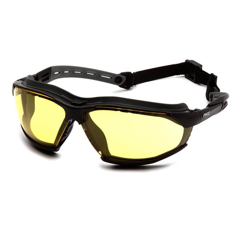 A pair of Pyramex Isotope H2MAX safety glasses, featuring a black frame and yellow-tinted anti-fog lenses, comes with an adjustable strap and is designed to meet ballistic impact standards for sports or outdoor activities.