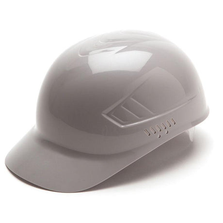 The Pyramex Ridgeline Bump Cap 4 Pt Ratchet Hard Hat is a shiny, light gray cap featuring ventilation slots on the side. It is positioned at a slight angle to highlight its smooth, reflective surface. With 4-point glide suspension, it provides excellent protection against scalp lacerations while maintaining comfort and safety. This product is by Pyramex Safety and comes in a box of 16.