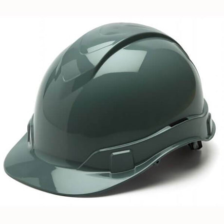 A glossy, dark green Pyramex Safety Ridgeline Cap Style 4 Pt Ratchet Hard Hat provides lightweight protection with its sleek surface and low-profile design, including a short brim perfect for construction or industrial environments. The helmet is showcased against a plain white background.