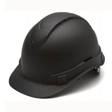 A Pyramex Safety Hydro Dipped Ridgeline Vented Cap Style hard hat in black, characterized by its sleek finish and low center of gravity, includes ventilation slits on top and an adjustable strap at the back. The helmet is displayed slightly tilted on a plain white background.