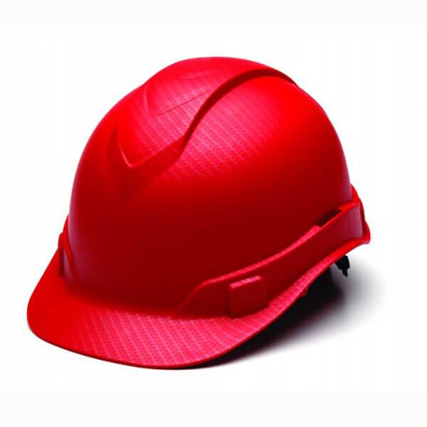 A Pyramex Hydro Dipped Ridgeline Cap Style hard hat, showcasing a sleek, low-profile design in red, is displayed against a plain white background. This Pyramex Safety product features a 4-point ratchet harness for a secure fit and includes both a brim and adjustable straps for optimal safety.