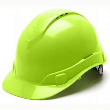 The Pyramex Safety Ridgeline Hard Hat features a vibrant green, glossy look, complete with a front visor and side clips. This vented cap style helmet provides lightweight protection, perfect for construction or industrial environments.