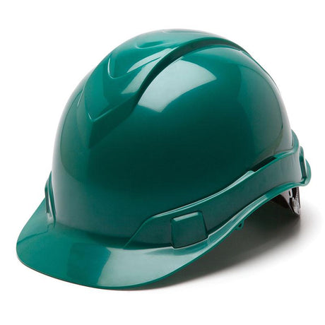 The Pyramex Ridgeline Cap Style 6 Pt Ratchet Hard Hat, showcased from a front-left angle in a shiny green color, exhibits a low-profile design that meets ANSI/ISEA Z89.1-2014 standards. Positioned on a plain white background, it features a sturdy build with a brim and reinforcing ridges for optimal protection.