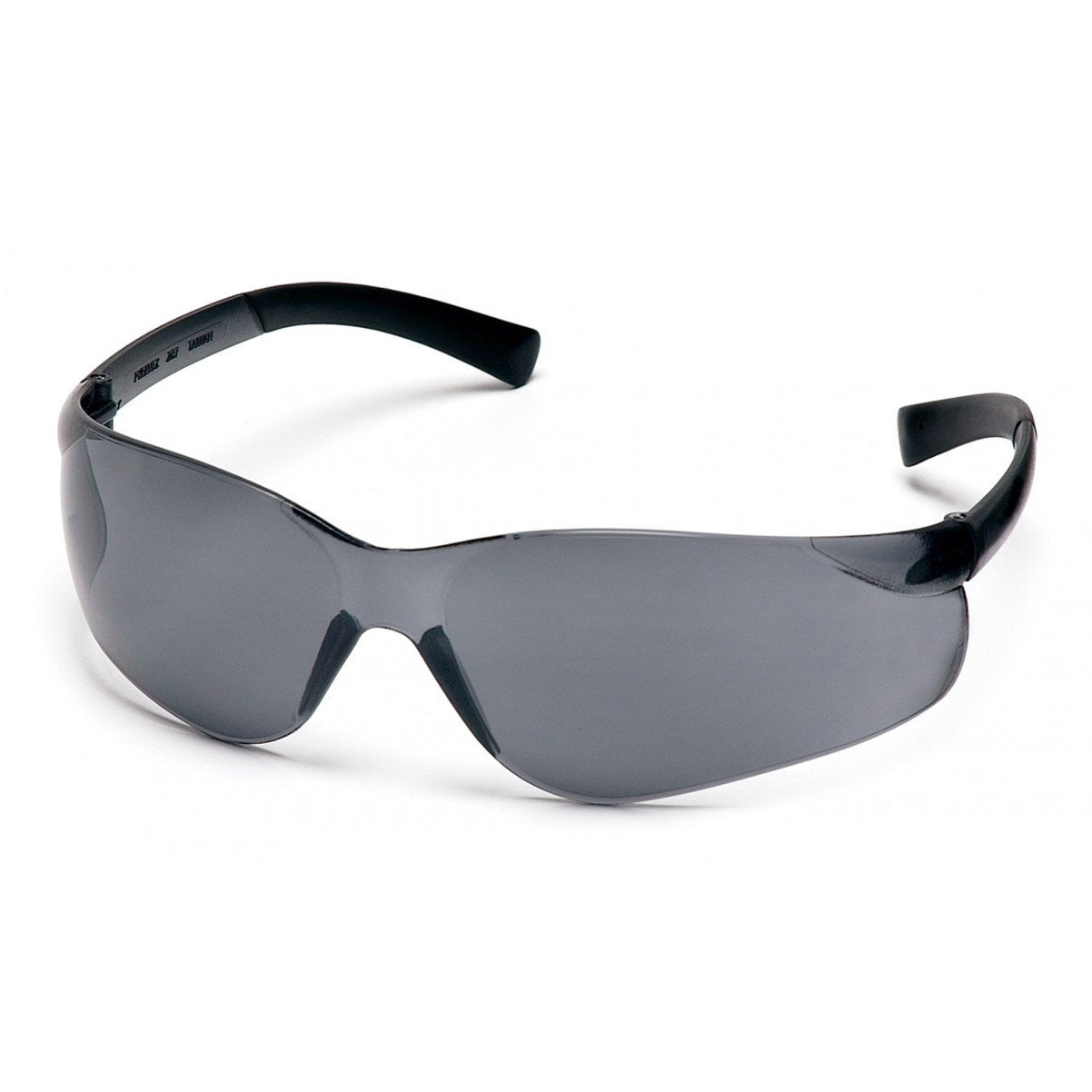 The Pyramex Ztek Safety Glasses S2510S (12/box) by Pyramex Safety feature sleek black wraparound frames with UV protection and dark lenses for a combination of style and safety. Their glossy finish enhances the scratch-resistant design, all elegantly showcased on a white surface.