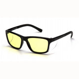 A pair of Pyramex Conaire Safety Glasses SB107 with black rectangular rims and polycarbonate, yellow-tinted lenses providing UVA/B/C protection is placed on a white surface. The slightly curved arms enhance their design.