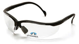 A pair of Pyramex Venture II V2 Reader Safety Glasses with clear lenses and black frames, featuring the "Pyramex" brand printed next to a blue and white pyramid logo. These glasses comply with OSHA ANSI Z87.1 standards for eye protection.