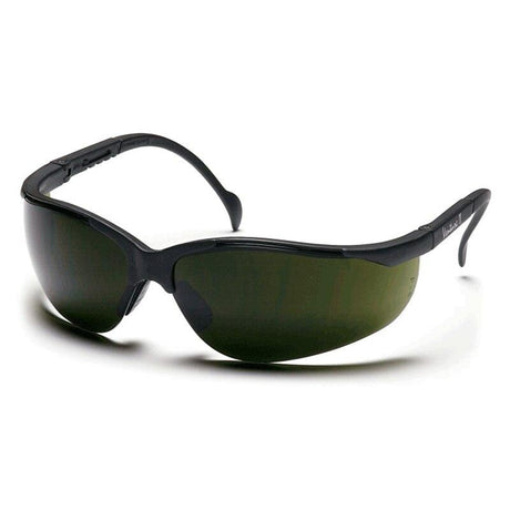 The Pyramex Venture II Welding Safety Glasses SB18_0SF by Pyramex Safety are displayed from a side angle against a white background, showcasing their black color, dark curved lenses, sleek wrap-around design, and UV protection.