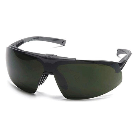 The Pyramex Onix Plus Welding Safety Glasses SB49_0STP by Pyramex Safety boast a sleek, dark design with wraparound IR filter lenses. Their large tinted lenses and smooth, glossy frame perfectly balance sportiness with modern style while adhering to ANSI Z87.1 certification for eye safety.