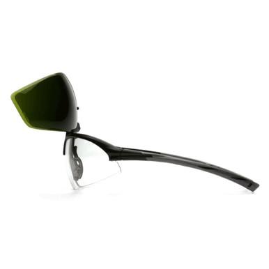 Side view of the Pyramex Onix Plus Welding Safety Glasses SB49_0STP, featuring a sleek black frame. One lens is flipped up to reveal a tinted green panel with an IR filter, indicating adaptability for various lighting conditions or activities. These glasses are ANSI Z87.1 certified by Pyramex Safety for superior protection.