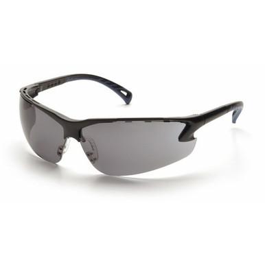 Featuring a sleek, black design, the Pyramex Venture 3 Safety Glasses SB57 by Pyramex Safety come with wraparound dark-tinted lenses and UV protection. Their slightly curved, aerodynamic frame adds to the stylish look, and the slim, ergonomic temples ensure a secure fit during active use. Available in boxes of 12.