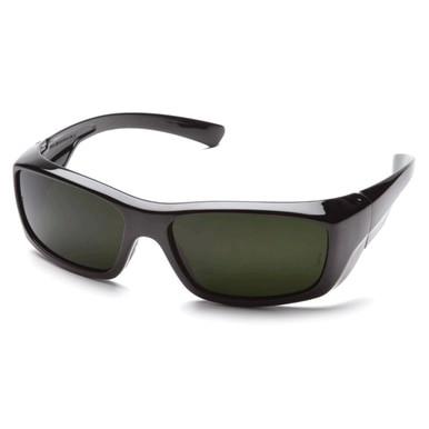 The Pyramex Emerge Welding Safety Glasses SB79_0SF, from the reputable brand Pyramex Safety, features a glossy finish and wraparound design for enhanced coverage and style. These sleek black glasses with dark lenses offer UV protection to keep your eyes safe under the sun.