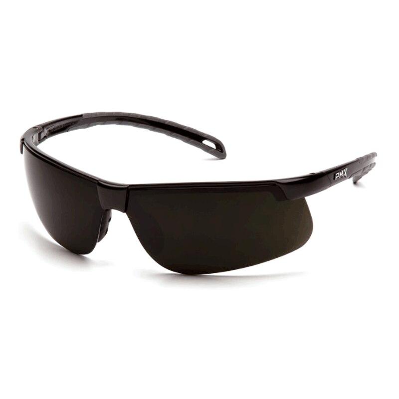 A pair of Pyramex Ever-Lite Welding Safety Glasses features a sleek design with a wraparound style, dark lenses, and UV protection. The slightly curved frame ensures a snug fit, and the straight arms have a slight bend at the ends for added comfort.