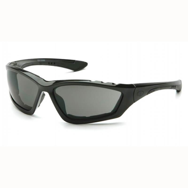 Introducing the Pyramex Accurist Anti-Fog Black Safety Glasses. These safety glasses boast a stylish wraparound design with dark tinted lenses and a robust frame. They provide exceptional UVA/B/C protection and feature a discreet logo on the arm, making them perfect for outdoor activities. Available in packs of 12 from Pyramex Safety.