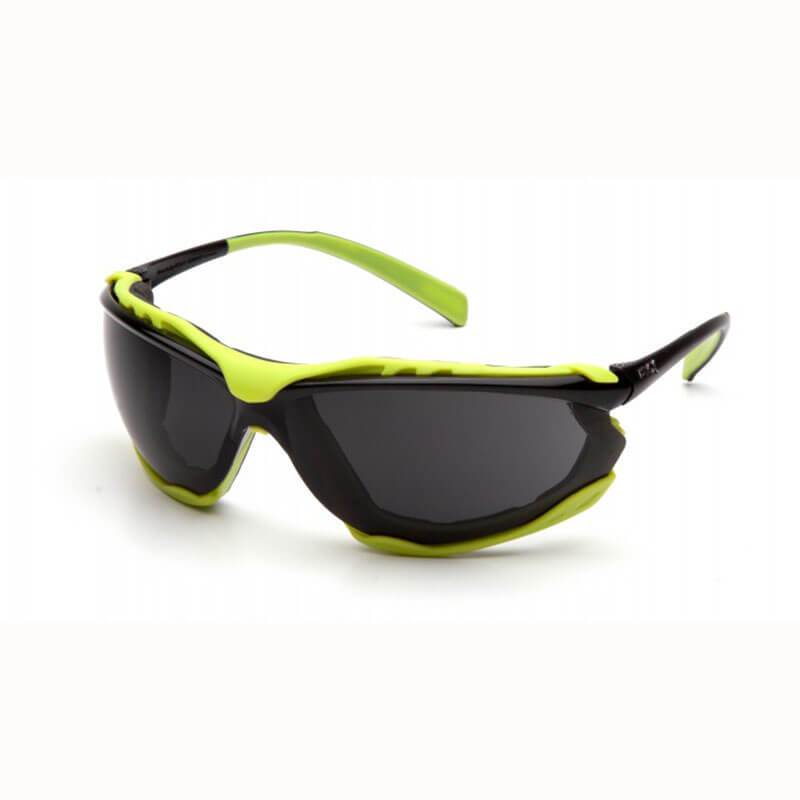 The Pyramex Proximity H2MAX Anti-Fog Lens Safety Glasses, featuring vibrant green and black frames, are displayed on a white background.