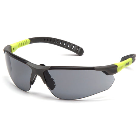 Introducing the Pyramex Sitecore Safety Glasses SGL101_0DTM by Pyramex Safety, featuring a sleek black and neon yellow design with a wraparound style. These glasses come with dark UV-resistant lenses and an anti-fog coating to ensure clear vision at all times. Available in boxes of 12.