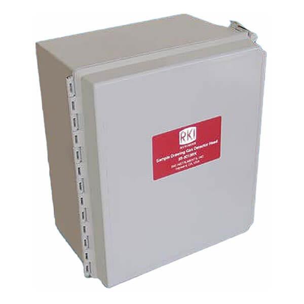 The product is an RKI Instruments 35-3010RK Multi-Gas Sample Draw Detector Assembly. It features a rectangular gray metal enclosure with a hinged door and latch that resembles a NEMA 4X box. The front displays a red label with the white text "RKI," and one side contains evenly spaced openings, indicating its function as a multi-gas detector housing.