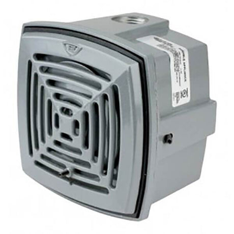 The RKI Fixed Systems Horn - Non Hazardous Locations by RKI Instruments is a square, gray unit with a slatted front grill. It's perfect for non-hazardous settings and designed for wall mounting. It features a NEMA 4X enclosure and includes a side label detailing its specifications.