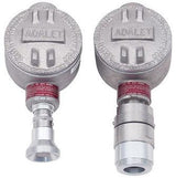 Two metallic industrial devices from RKI Instruments featuring round caps, embossed with "ADALET," and cylindrical connectors, bearing red labels below. These explosion-proof components seem to be RKI Direct Connect Gas Sensors designed for remote gas detection, compatible with LEL, CH4, HC, and CO2 gases.